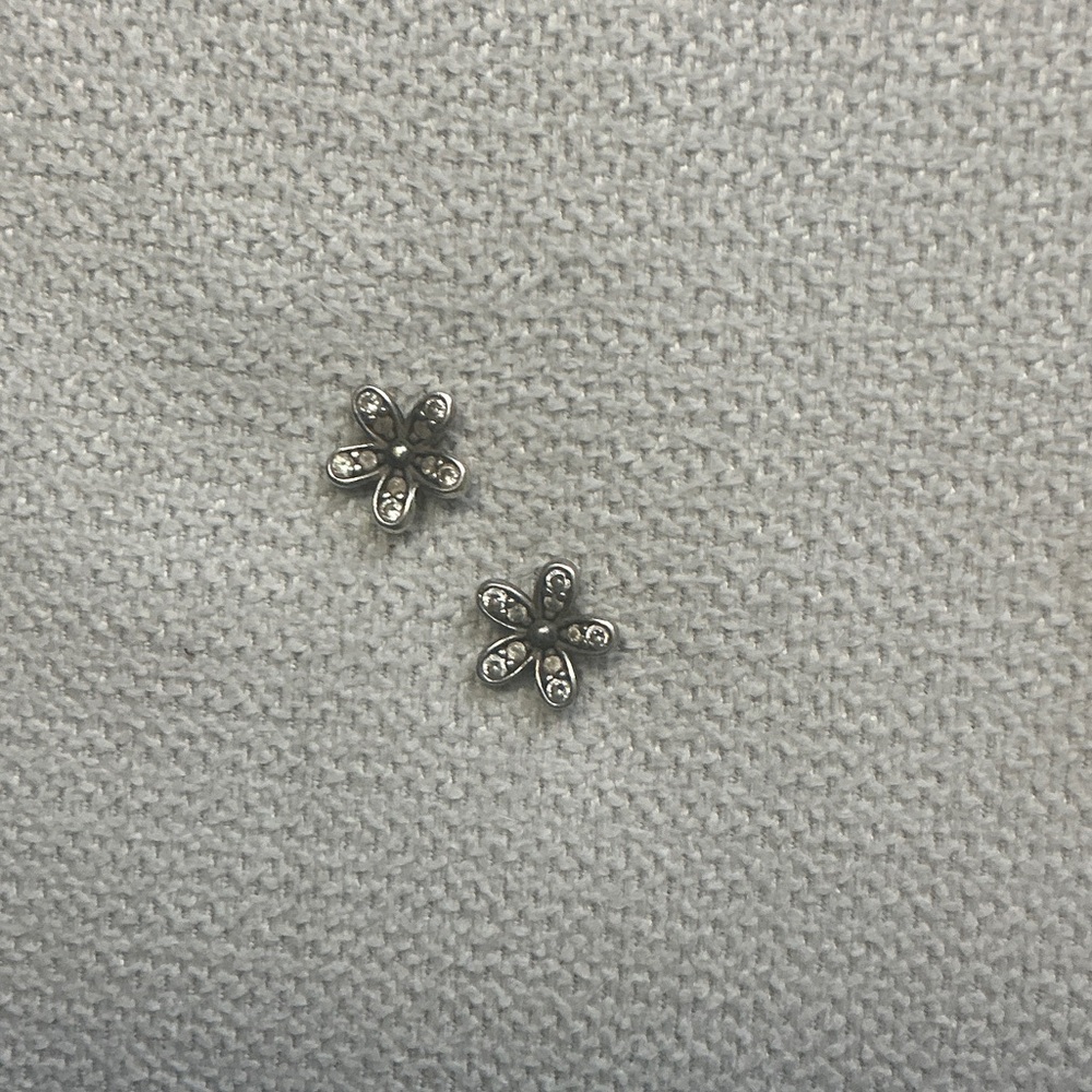 Pandora Daisy Flower Stud Earrings with cubic zirconia stones.